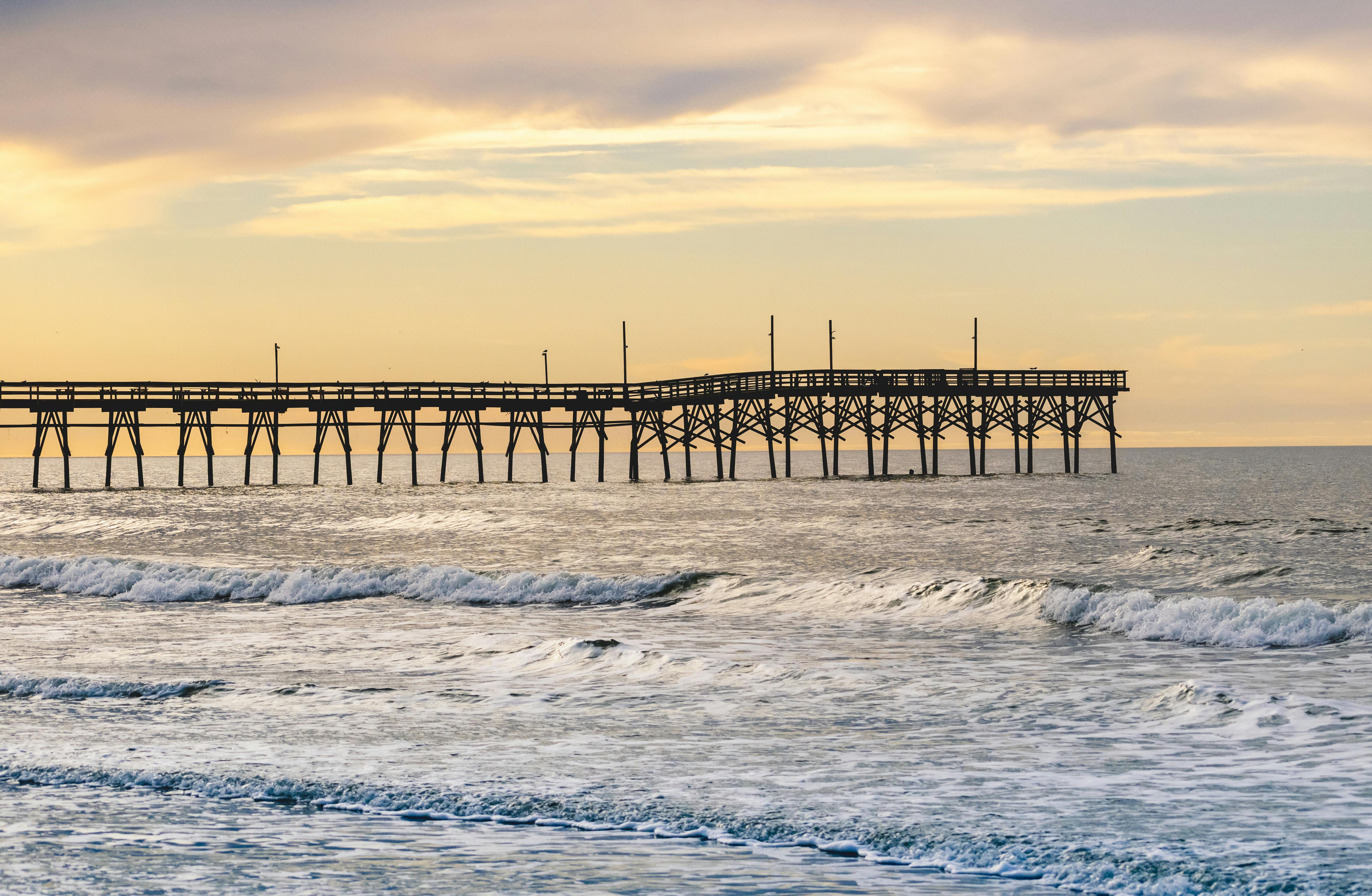 Peaceful coastal pier at sunset, representing hope and calm